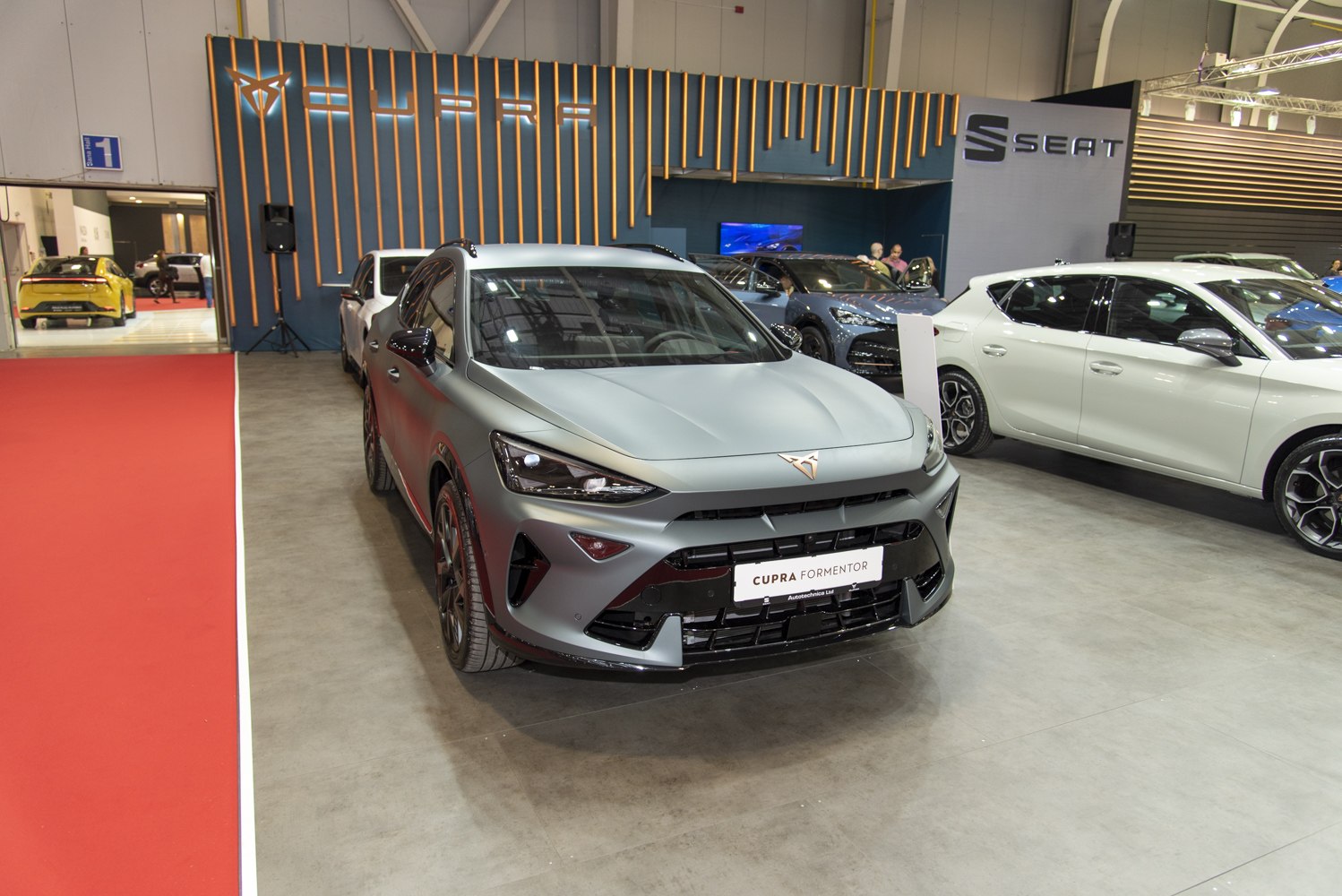 Sporty front view with sleek headlights and aggressive grille