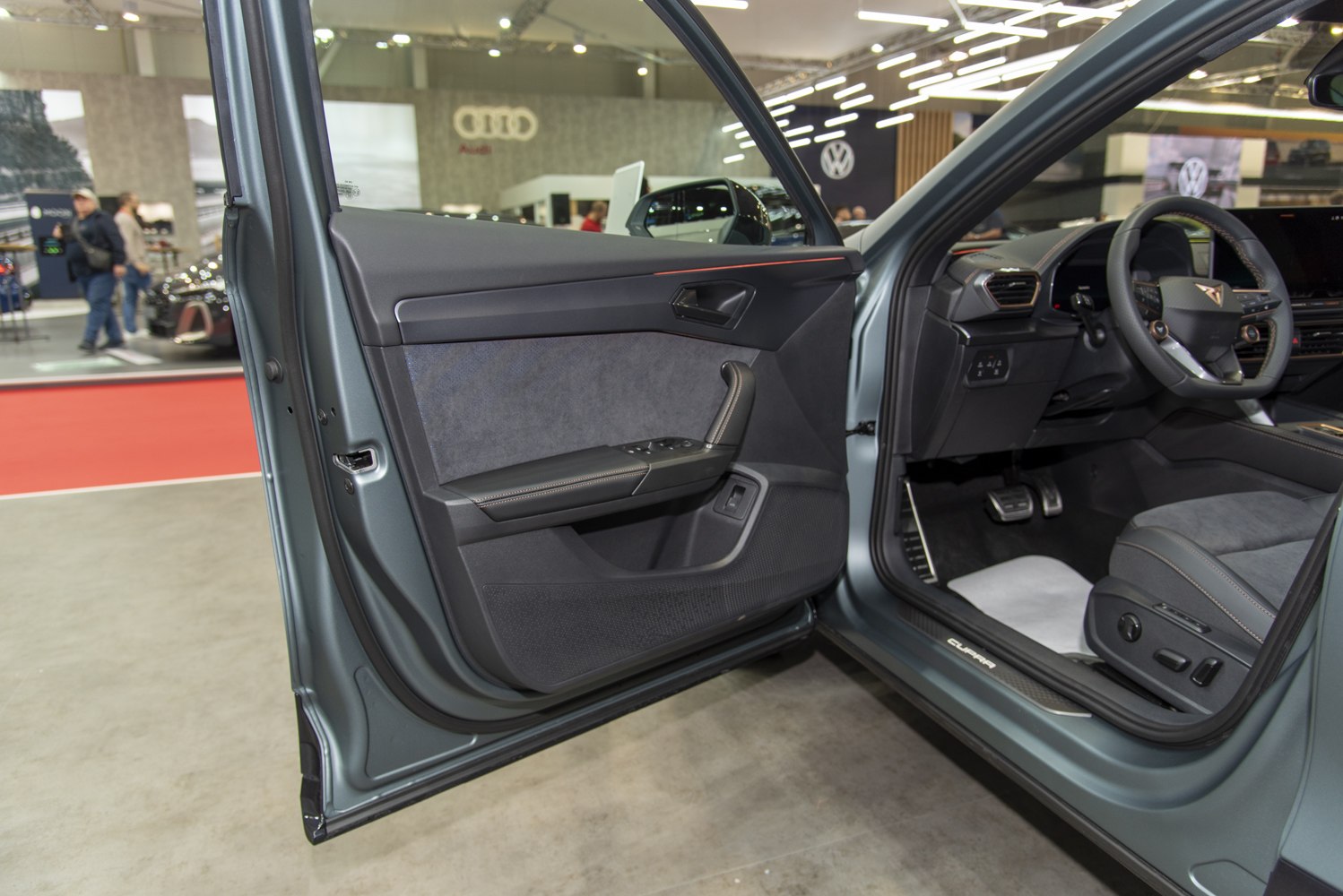 Interior door panel and driver seat with controls and pedals