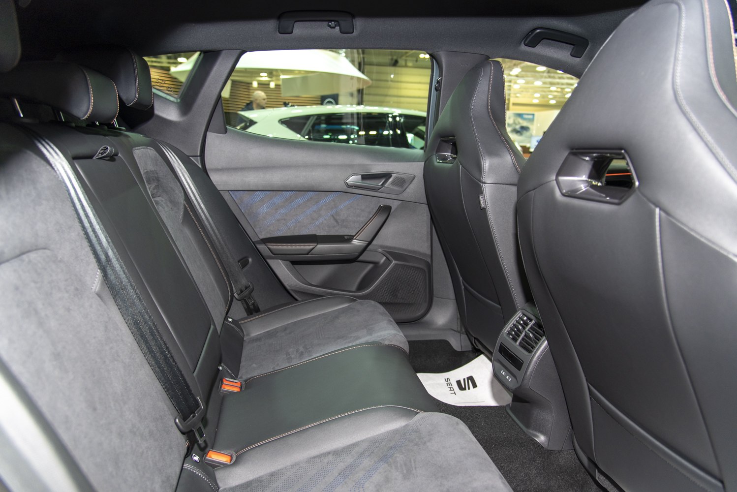 Rear seat interior with leather and suede upholstery, rear air vents and door panel detail
