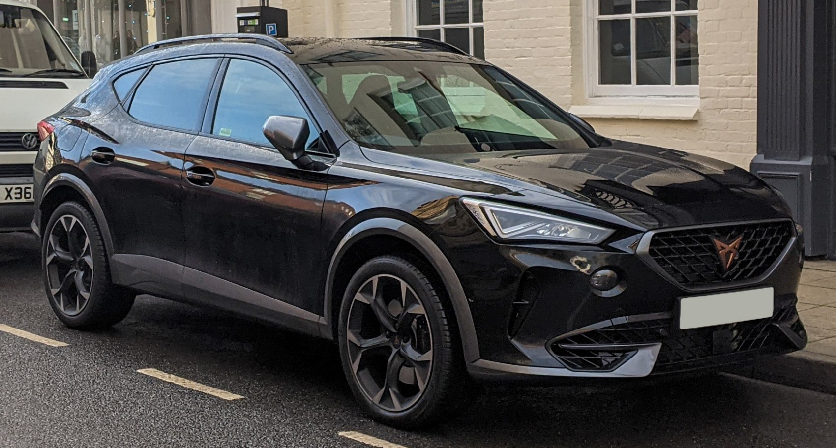 Black SUV with angular LED headlights and sporty alloy wheels
