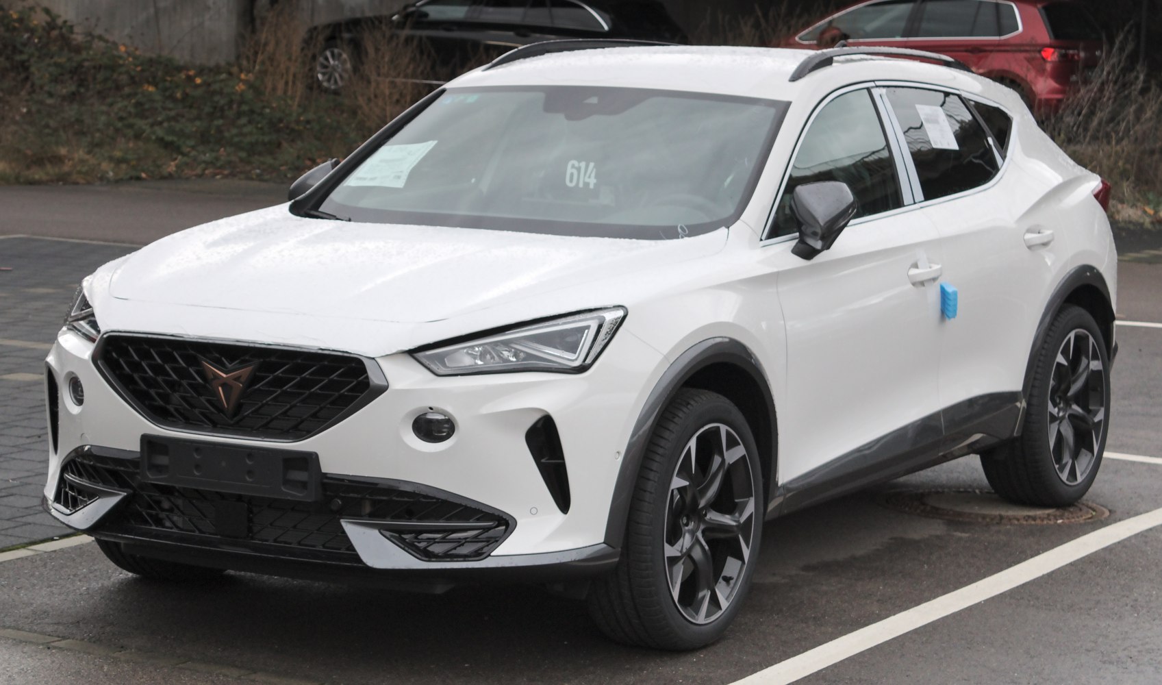 White compact SUV with angular headlights and sporty wheels