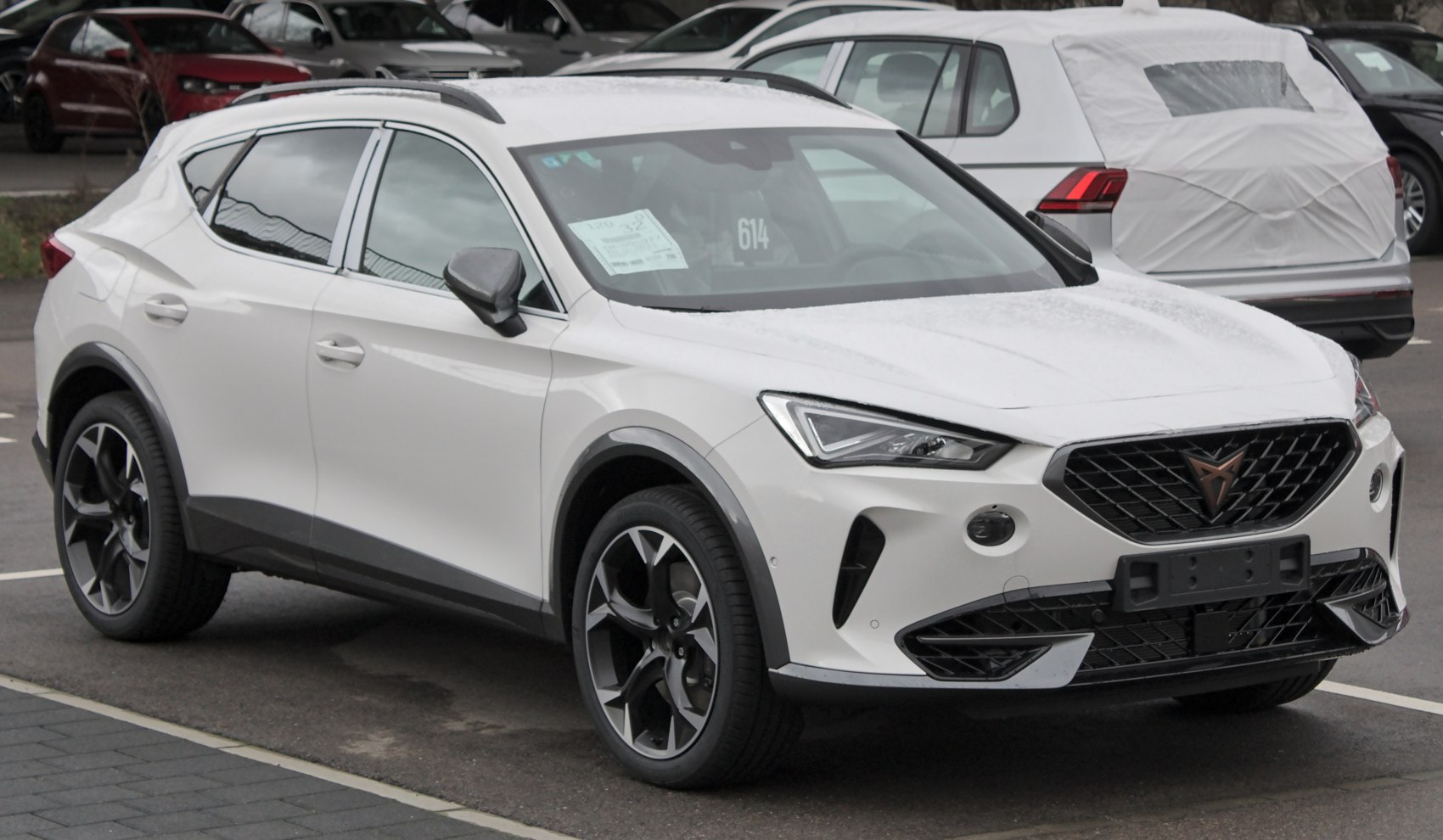 Front and side view of a modern SUV highlighting LED headlights and alloy wheels