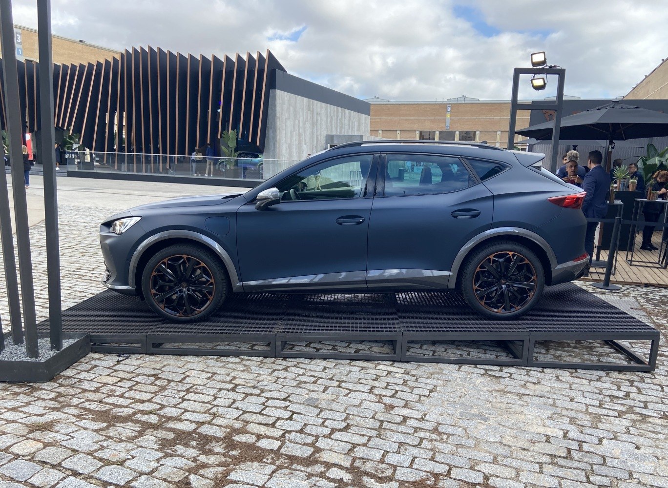 Side profile of crossover SUV with matte finish and black alloy wheels