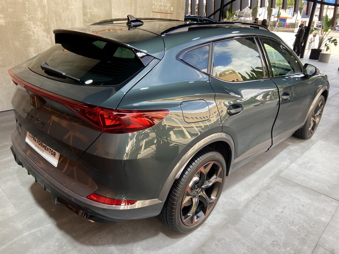 Rear and side profile with alloy wheels and roof spoiler