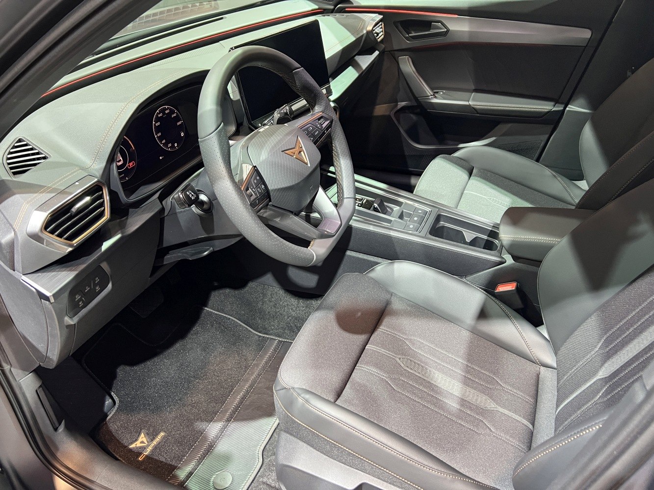 Modern car interior with digital dashboard and multifunction steering wheel