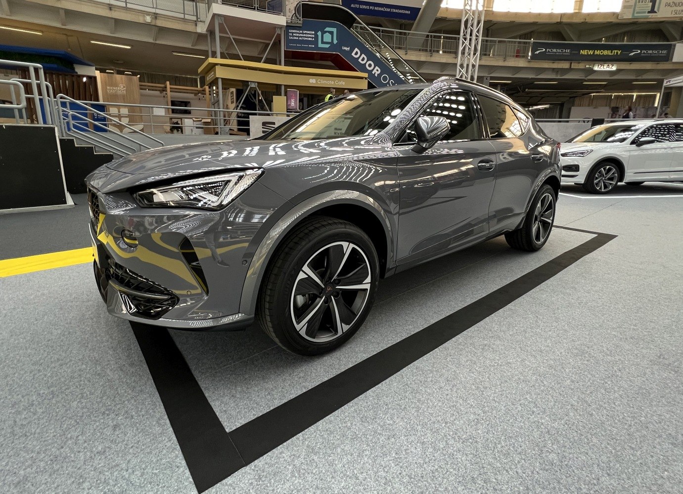 Sharp angular LED headlights and stylish alloy wheels on a sleek aerodynamic SUV.