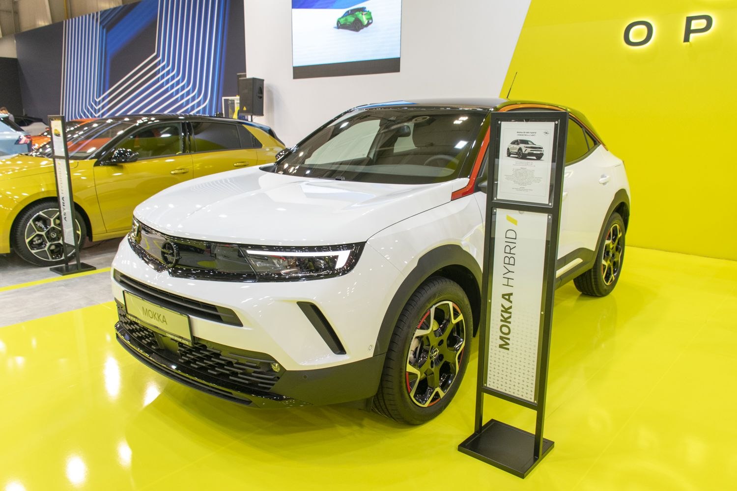 Modern front view with LED headlights and alloy wheels on hybrid SUV