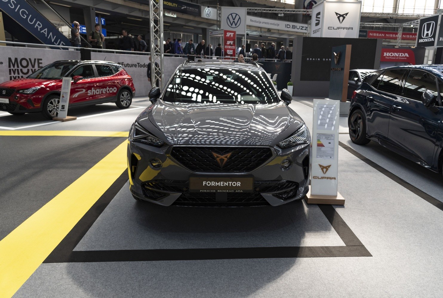 Sharp front view with aggressive headlights and bold grille.