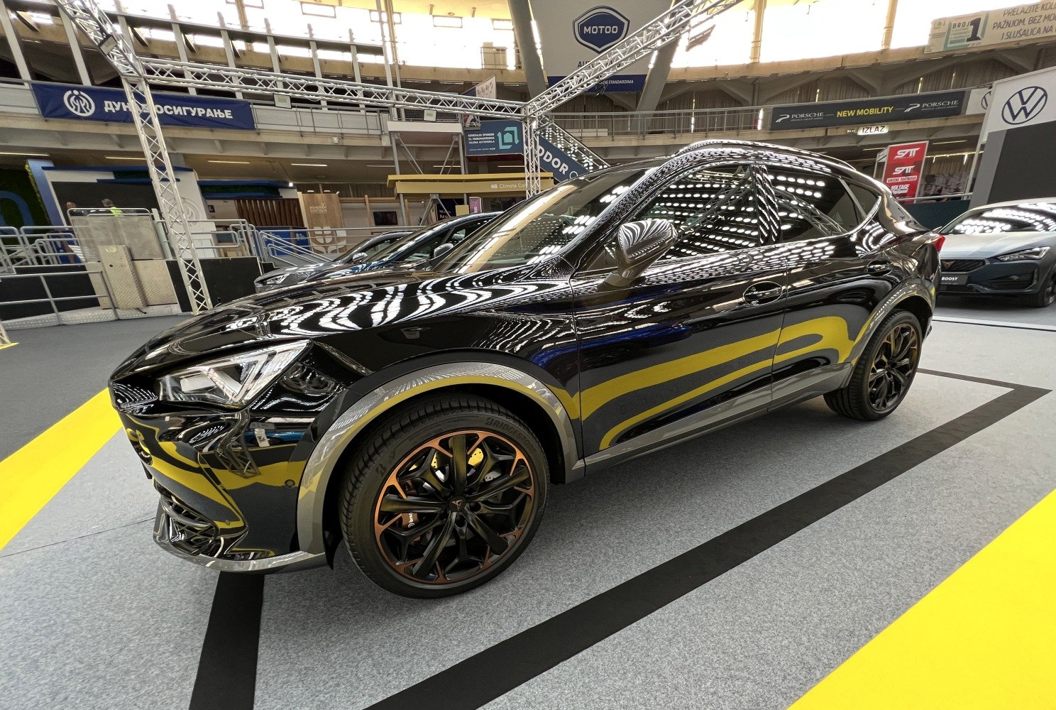 Black sporty SUV with unique dark alloy wheels and aerodynamic design