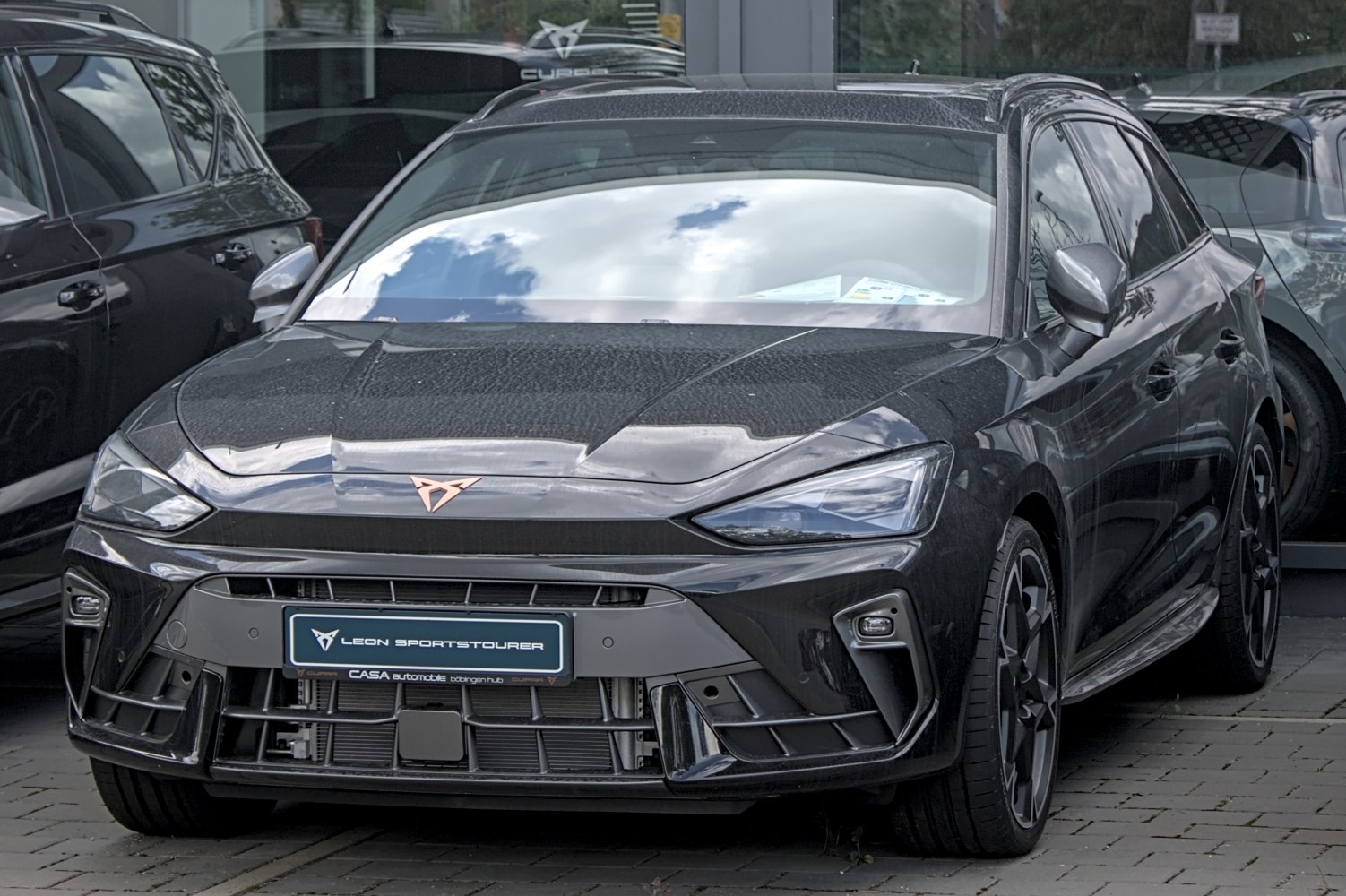 Sporty wagon front with LED headlights and aggressive grille