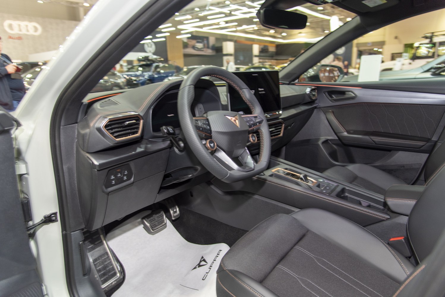 Sporty steering wheel and digital dashboard in modern car interior