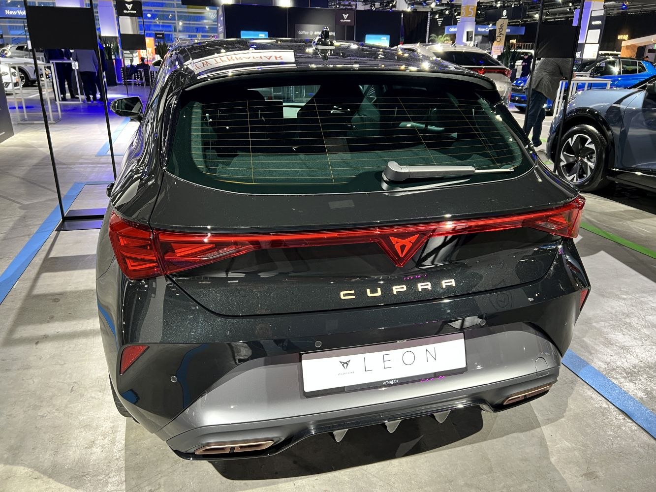 Sleek rear end with distinctive tail lights and dual exhausts