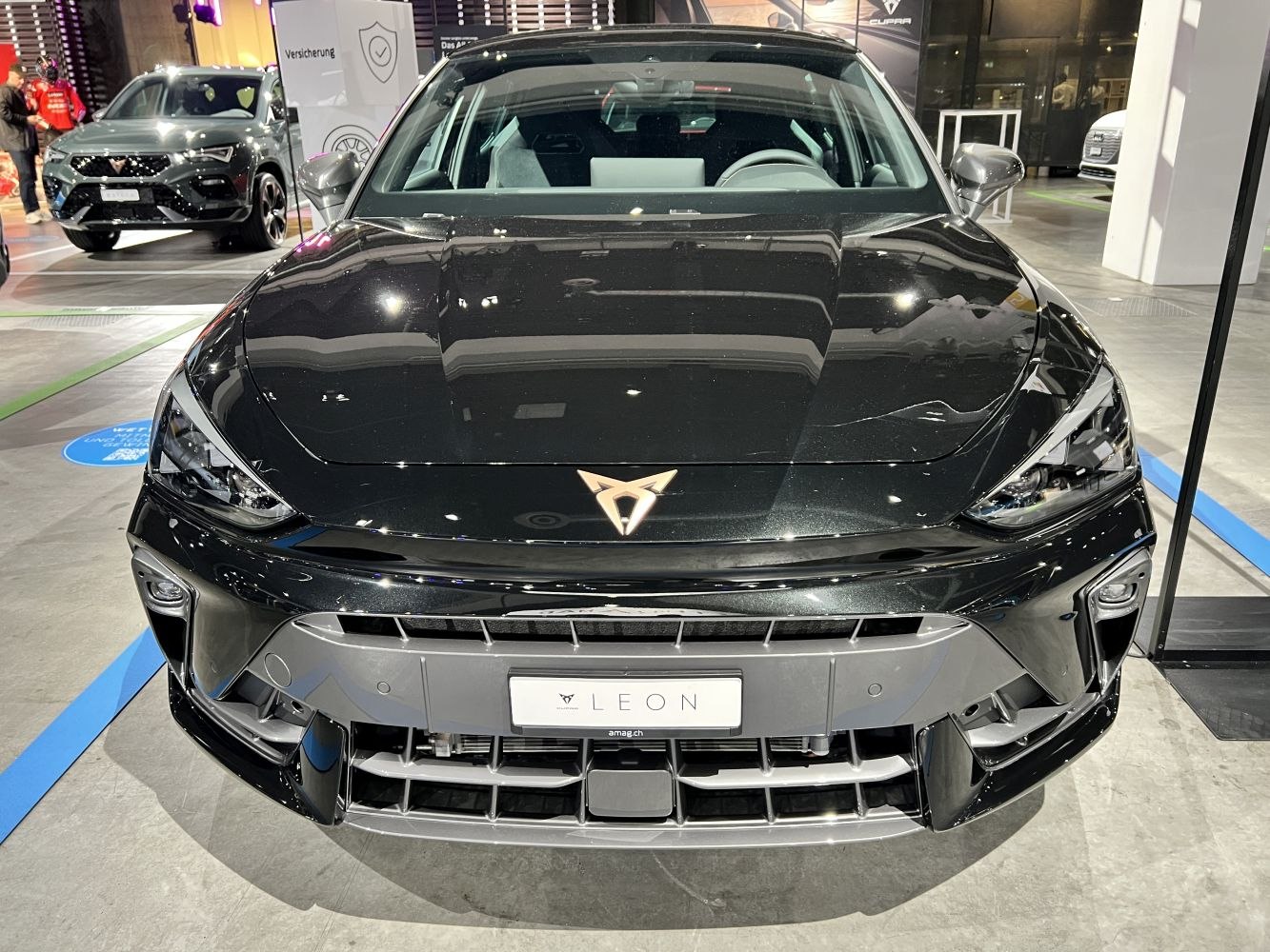 Front view with aggressive grille and sharp headlights