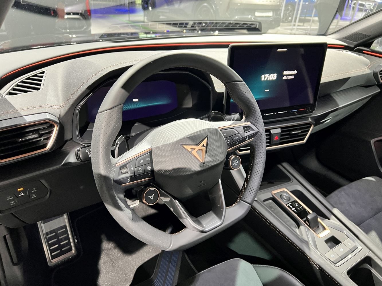 Sporty steering wheel with digital display and touchscreen infotainment