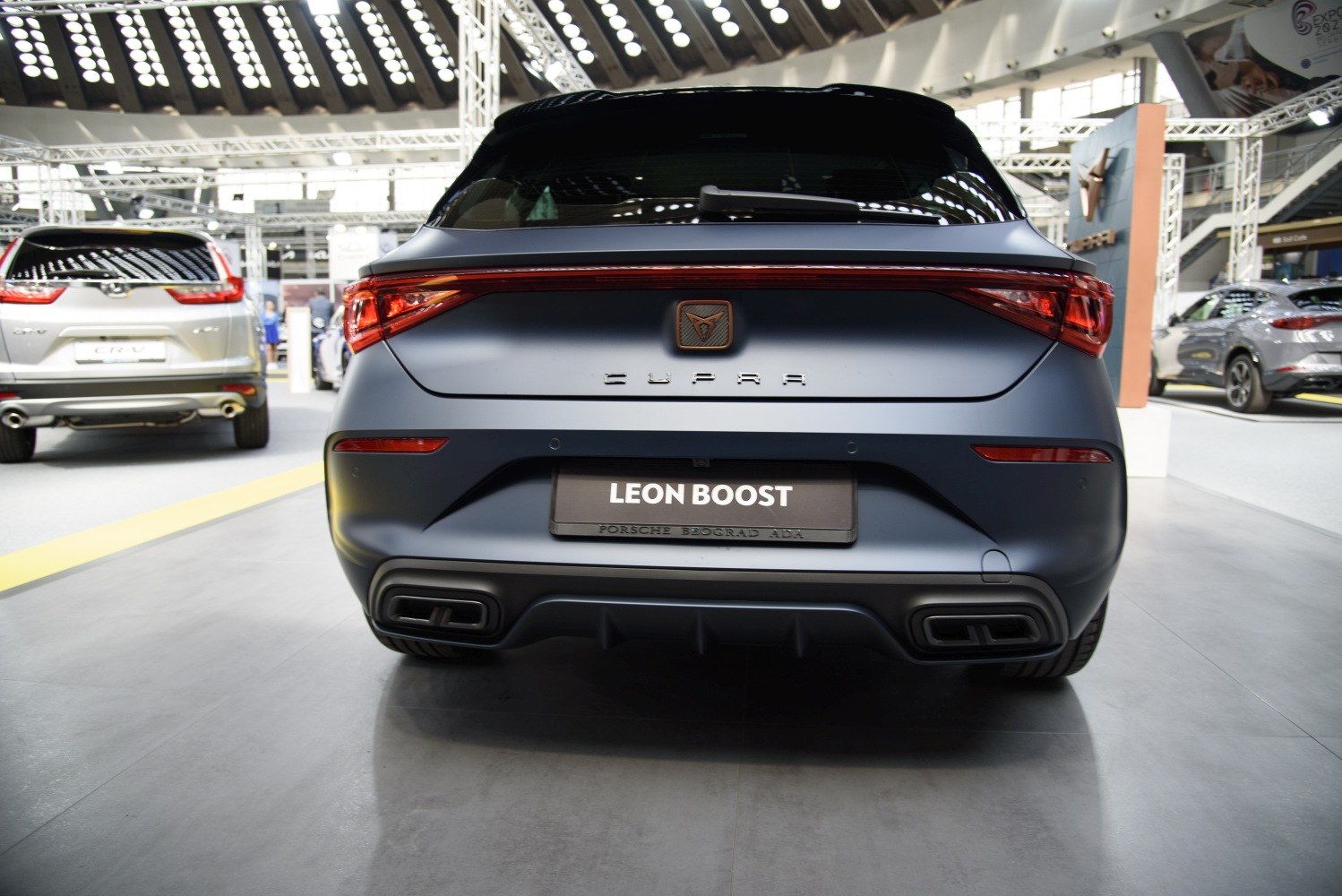Rear view featuring LED tail lights and dual exhausts on a hatchback.