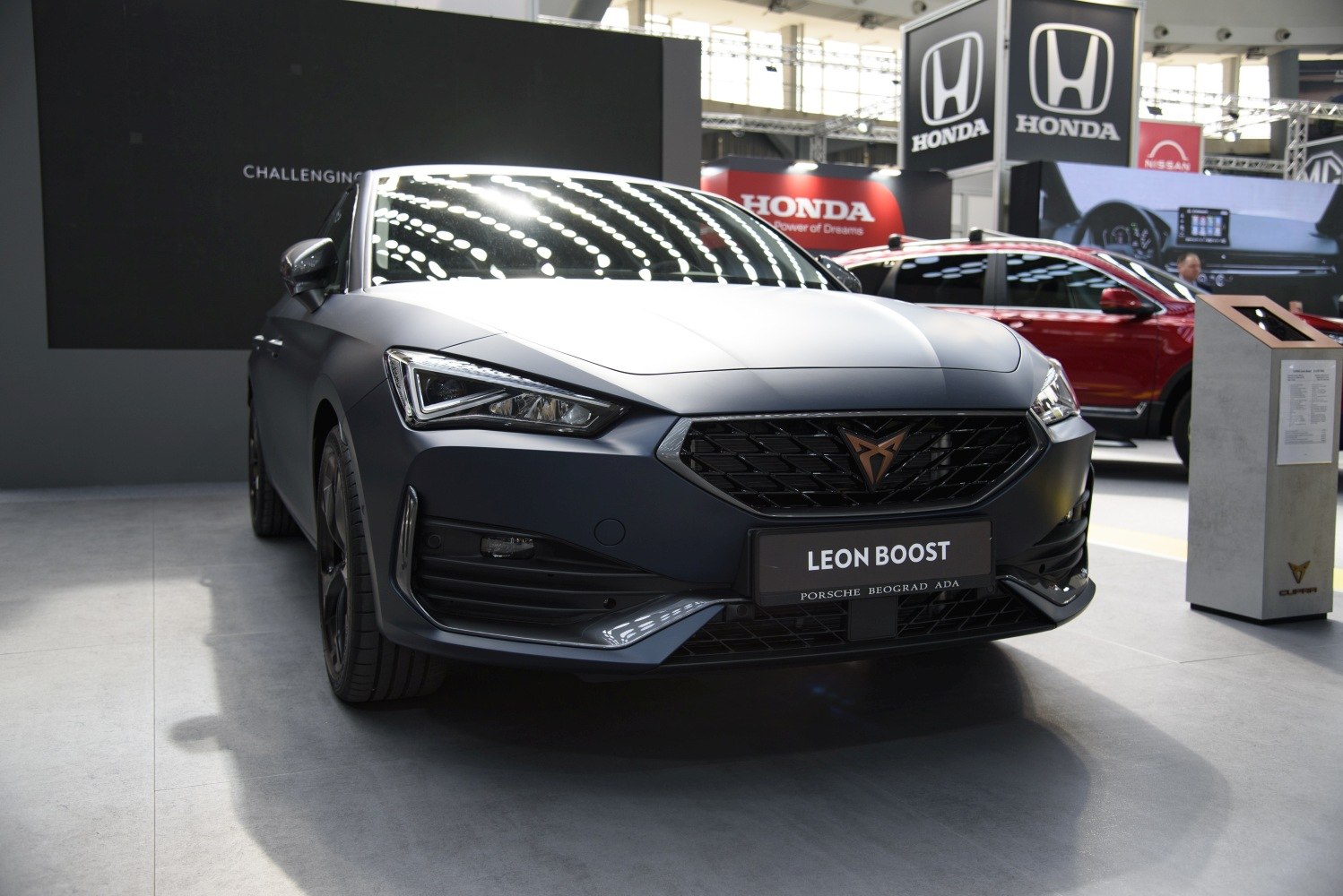 Front view with angular LED headlights and black mesh grille