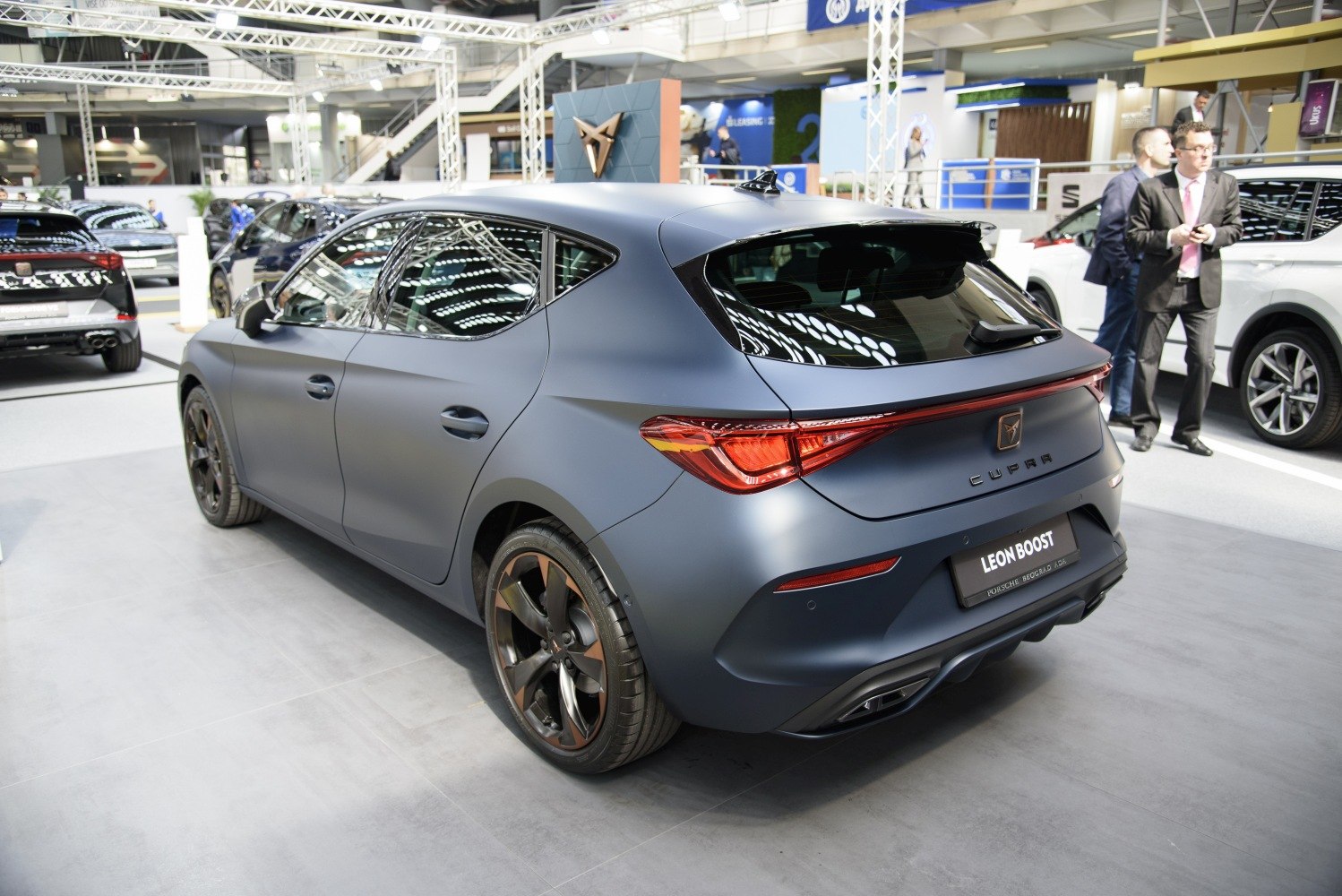 Matte blue hatchback rear with sleek LED taillights and sporty alloy wheels