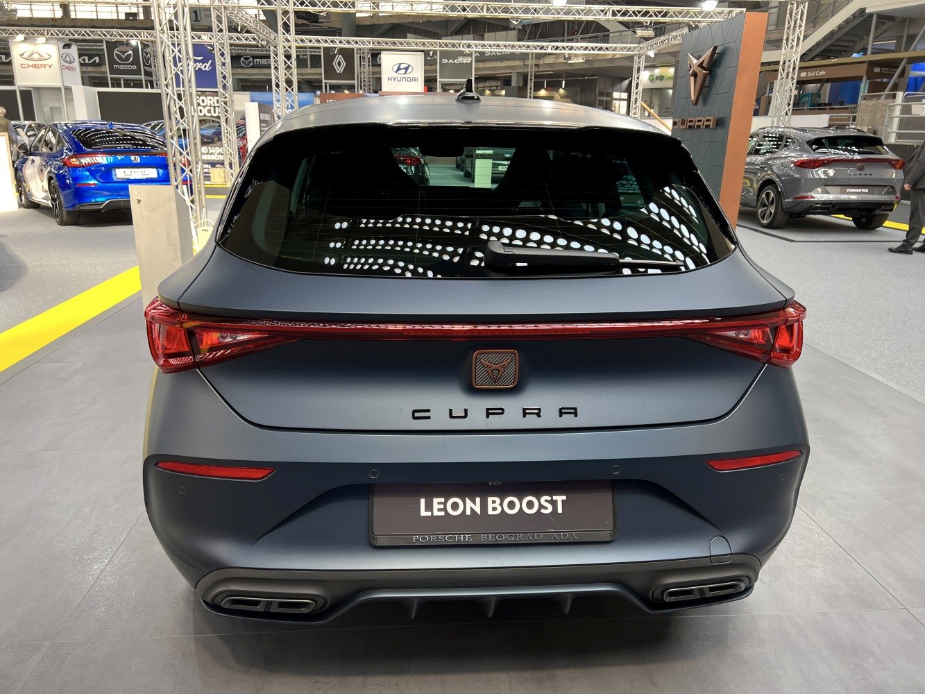 Rear view of hatchback with LED light bar and dual exhaust outlets