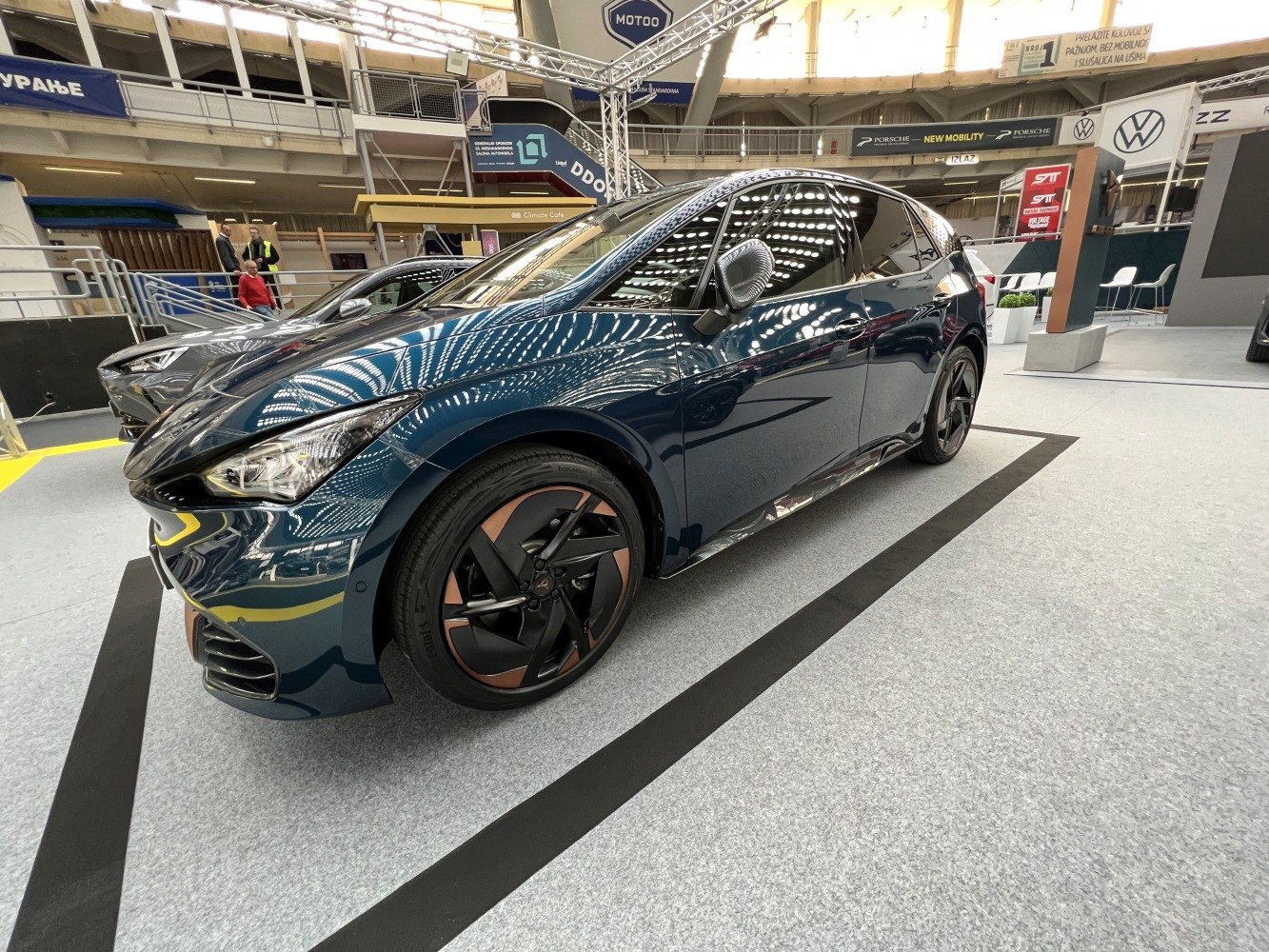 Electric hatchback with sleek aerodynamic shape and distinctive alloy wheels