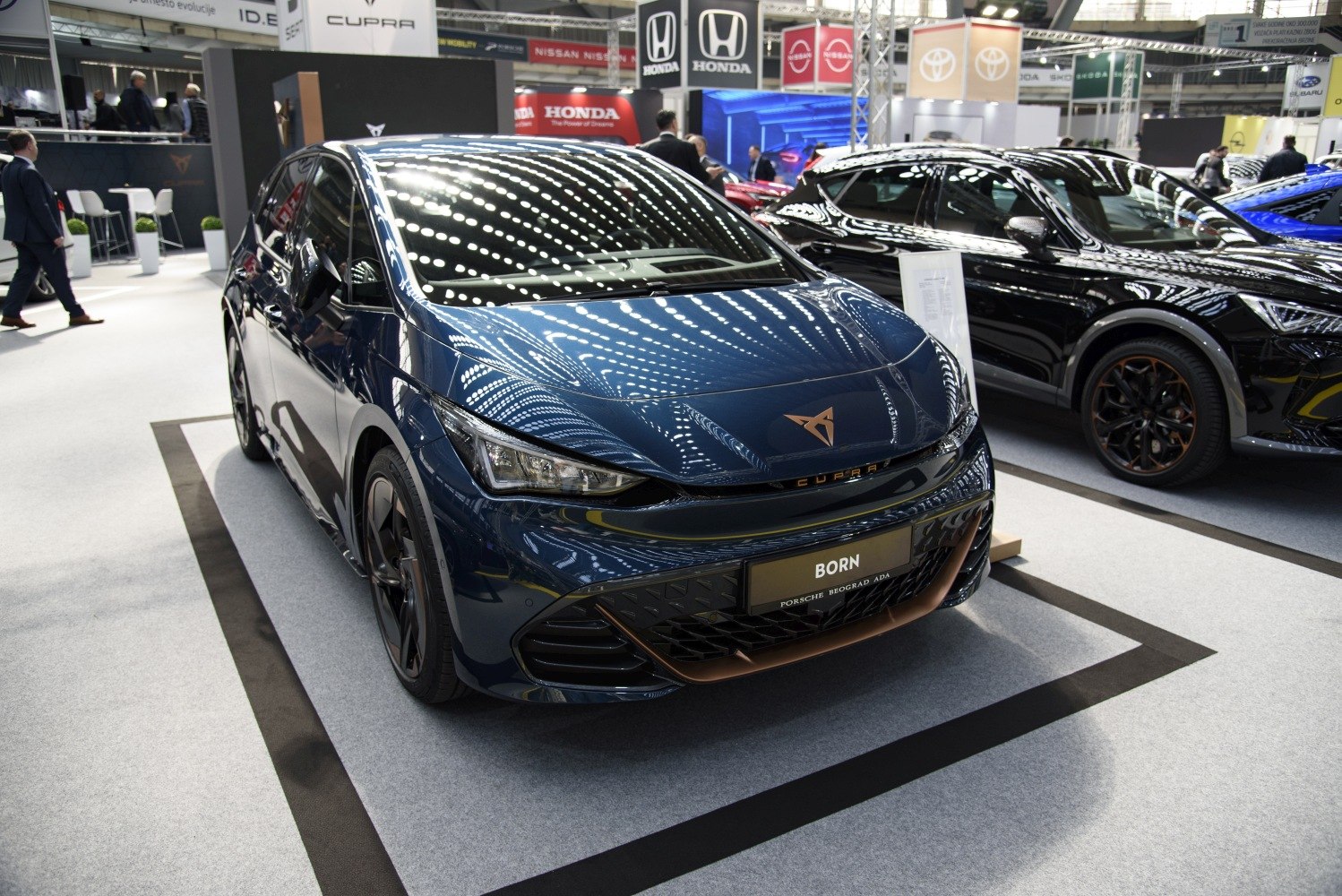 Aerodynamic front with sleek LED headlights and sporty design.