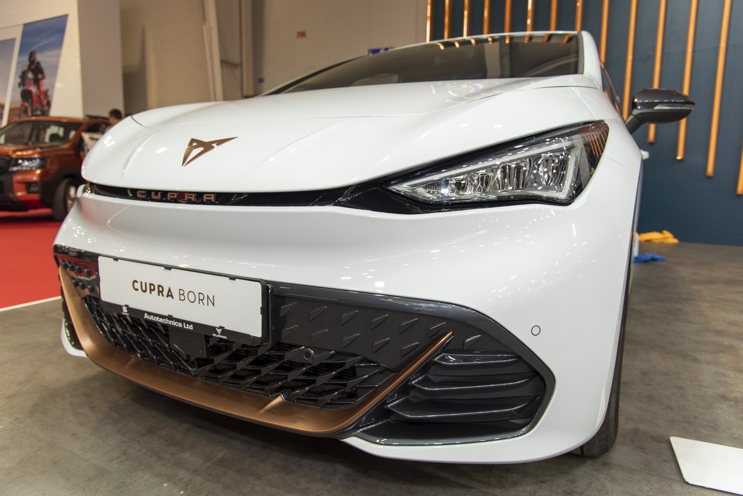Close-up of car front with LED headlights and distinct grille