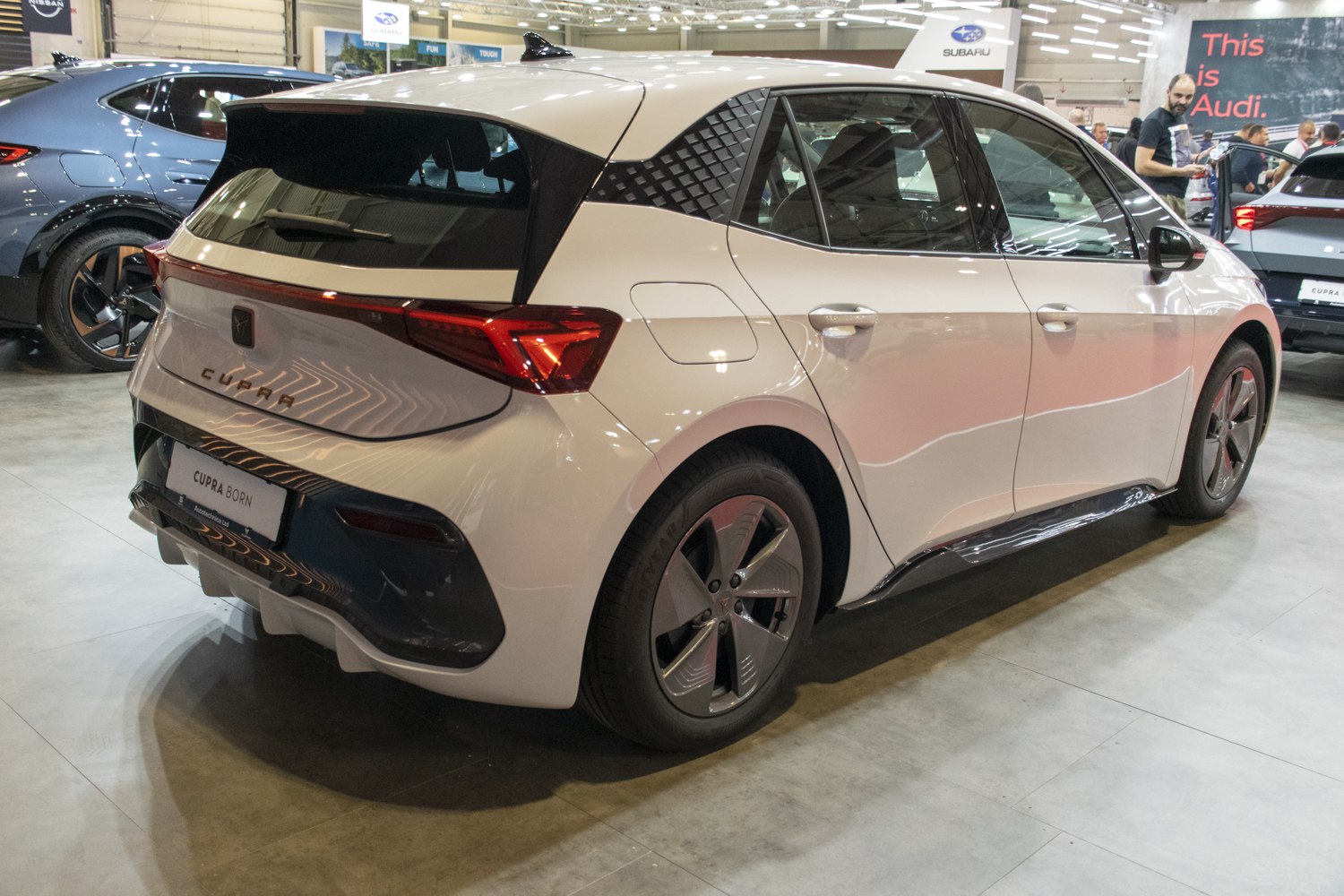 Rear three-quarter view of modern electric hatchback with geometric rear pillar design