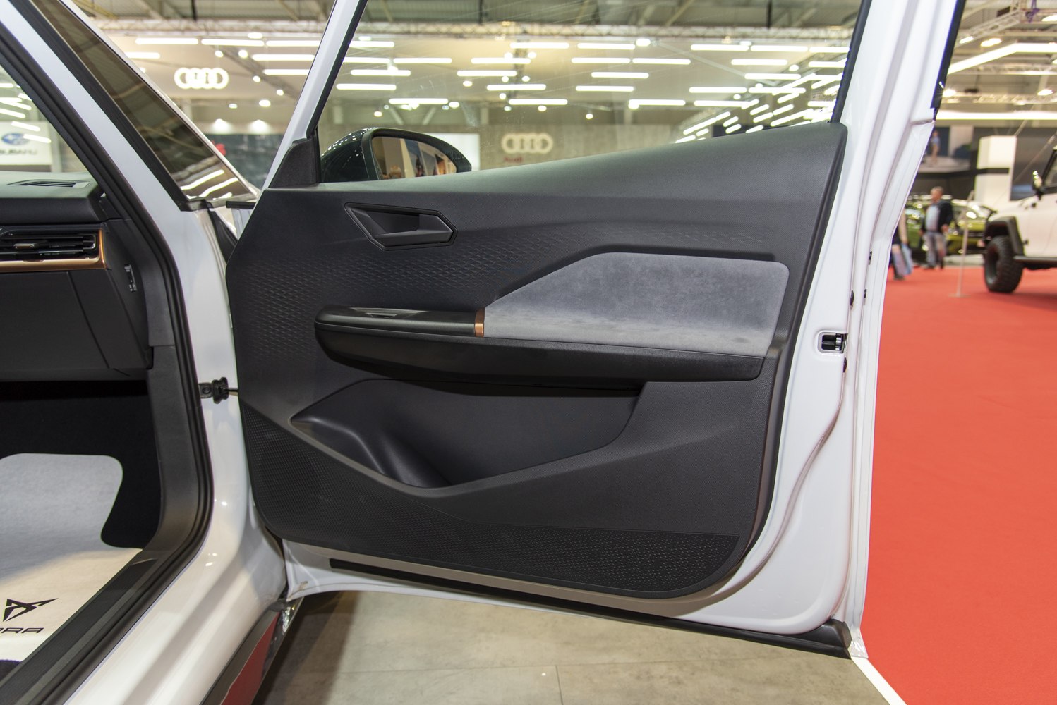 Modern car interior door panel with ergonomic design and mixed materials