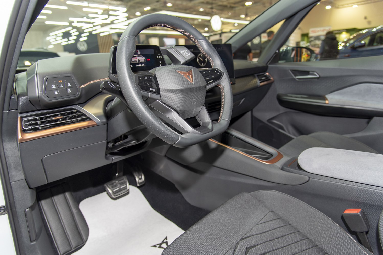 Modern steering wheel and digital dashboard in a car interior