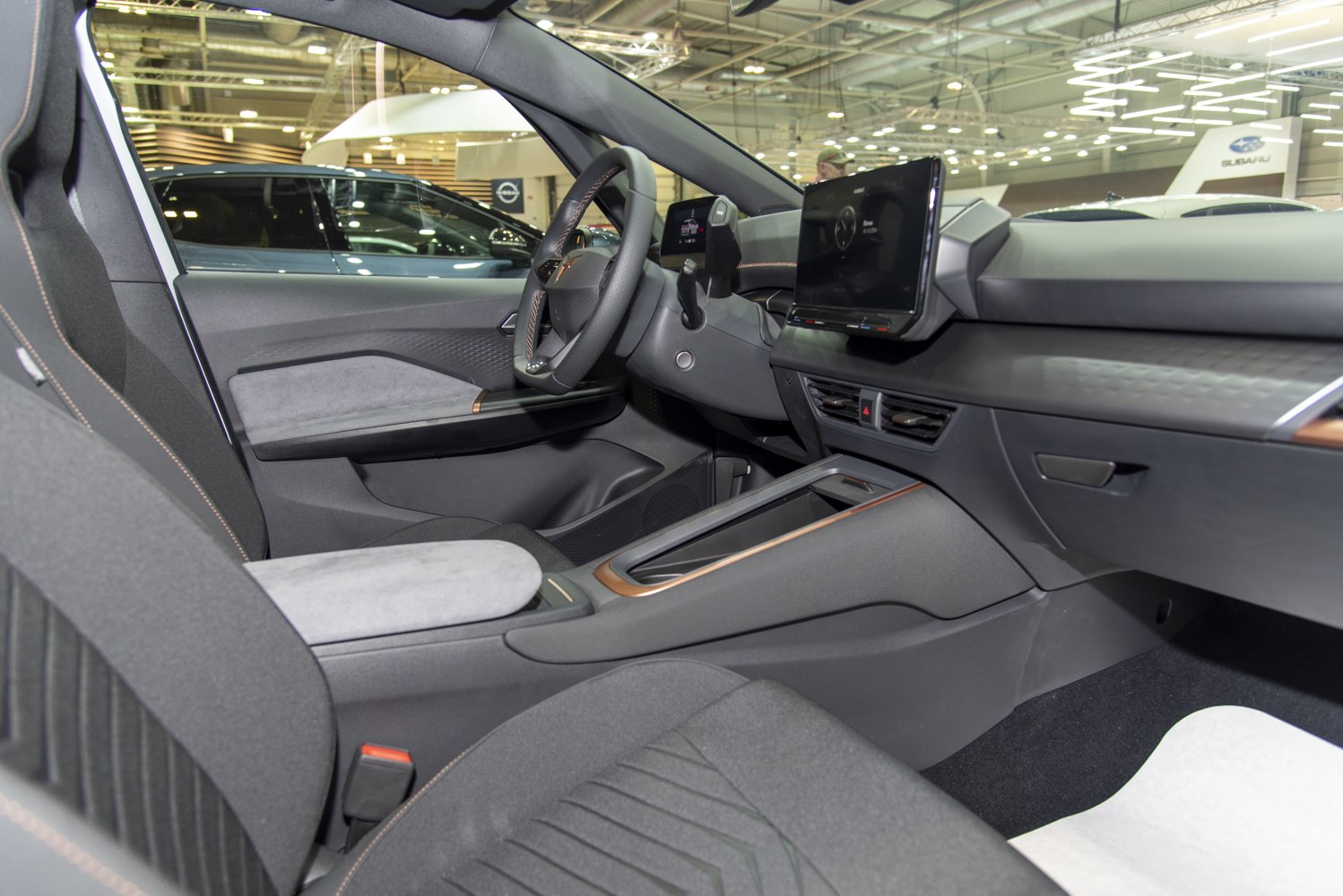 Minimalist electric car interior with touchscreen and ergonomic seats