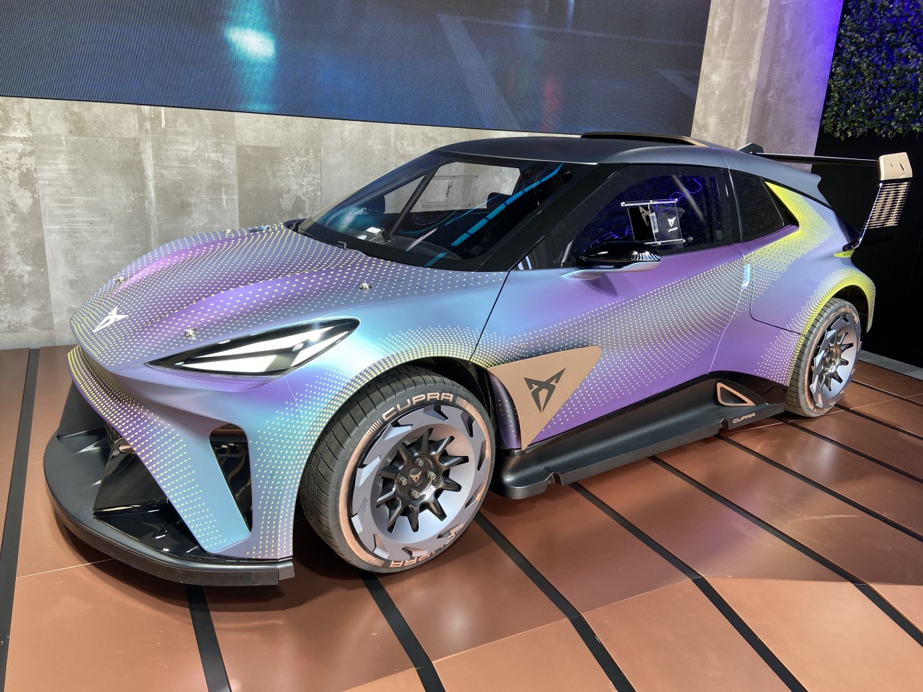 Futuristic electric hatchback with aerodynamic design and racing wing spoiler