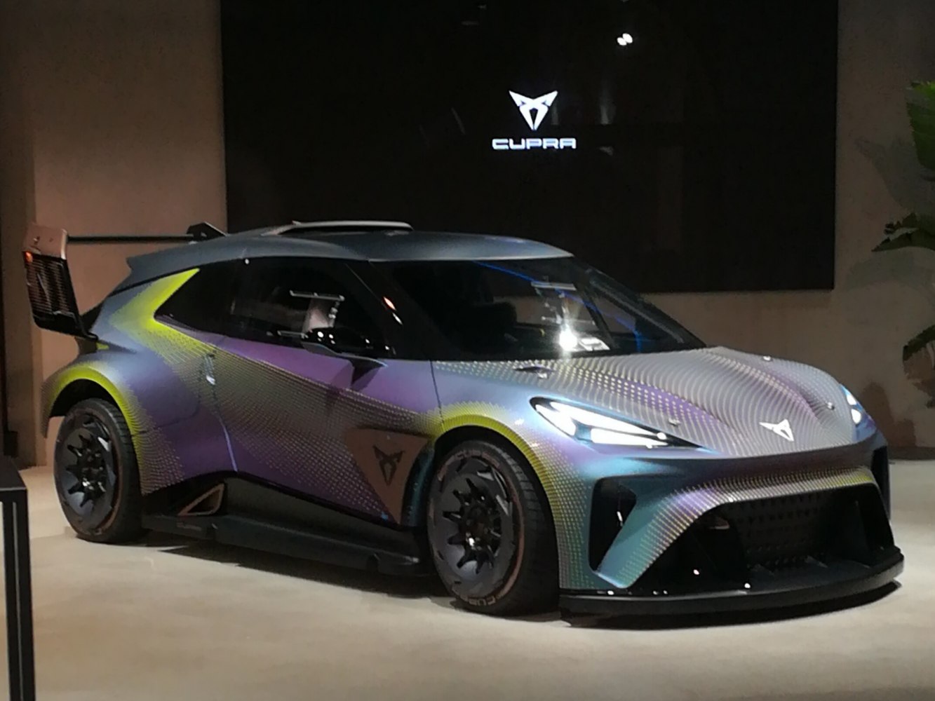 Futuristic electric hatchback with aerodynamic design and racing spoiler