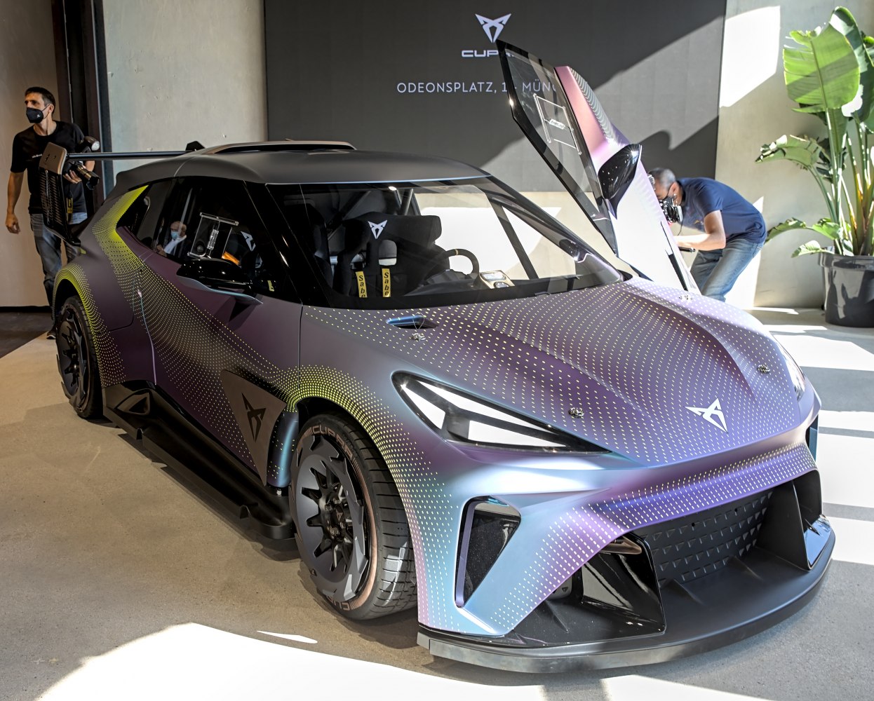 Electric sports car with gullwing doors and futuristic aerodynamic design