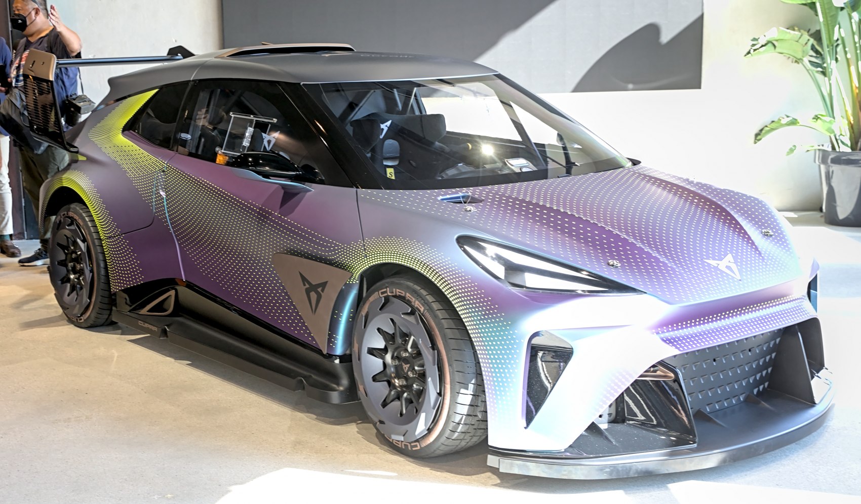 Futuristic aerodynamic hatchback with LED headlights and sporty wheels.