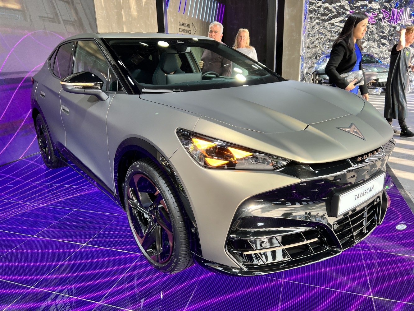 Sleek matte electric SUV with LED headlights and aggressive front grille.