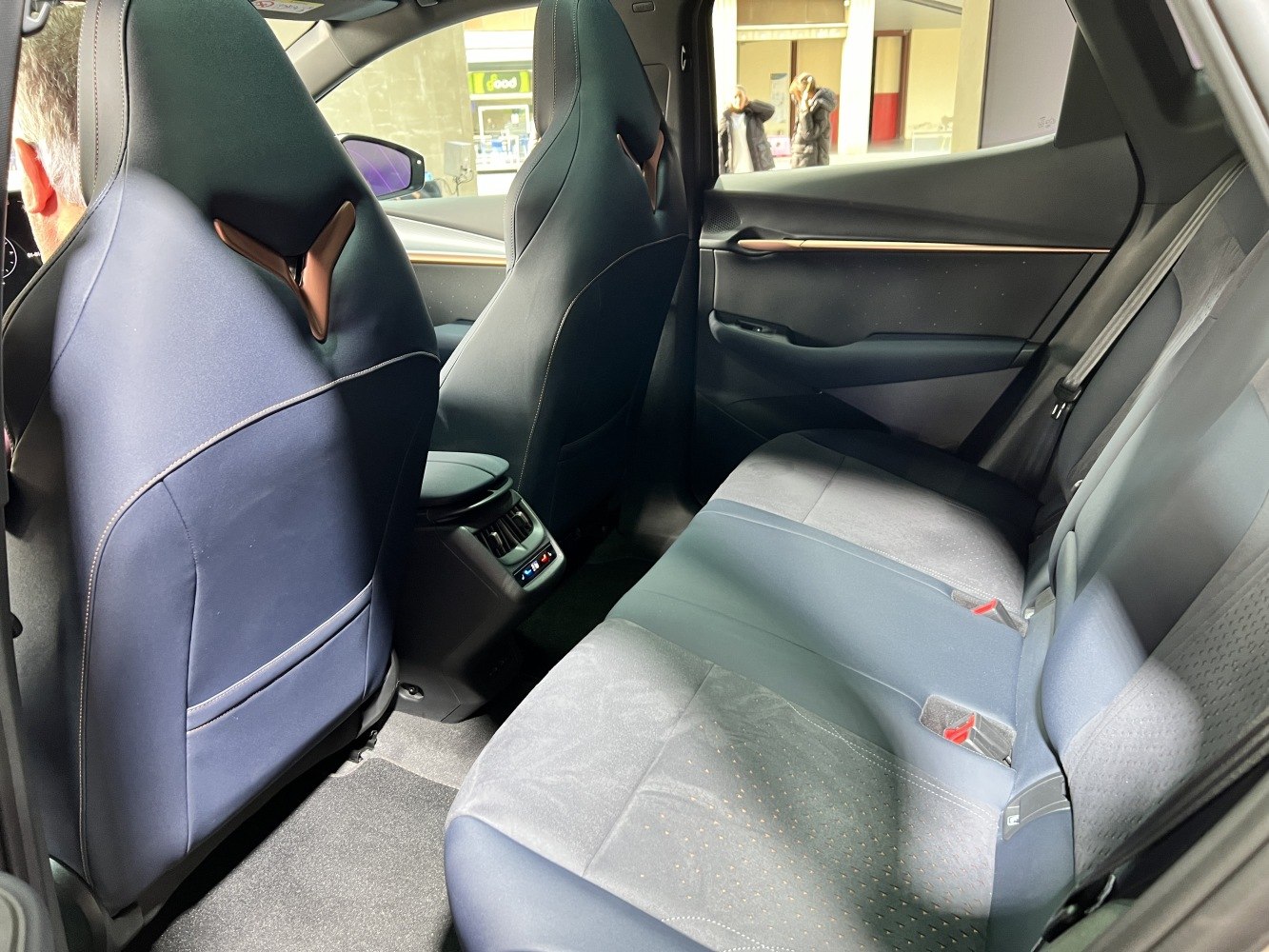 Rear seat area with modern upholstery and rear climate control panel