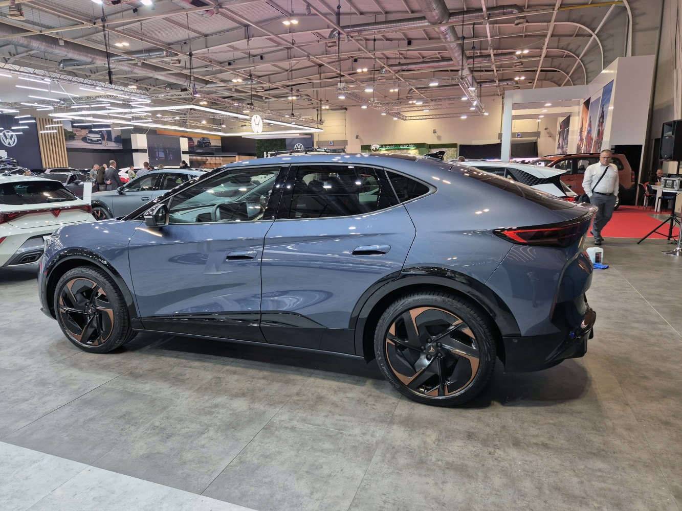 Side profile of a modern electric SUV coupe with distinctive alloy wheels