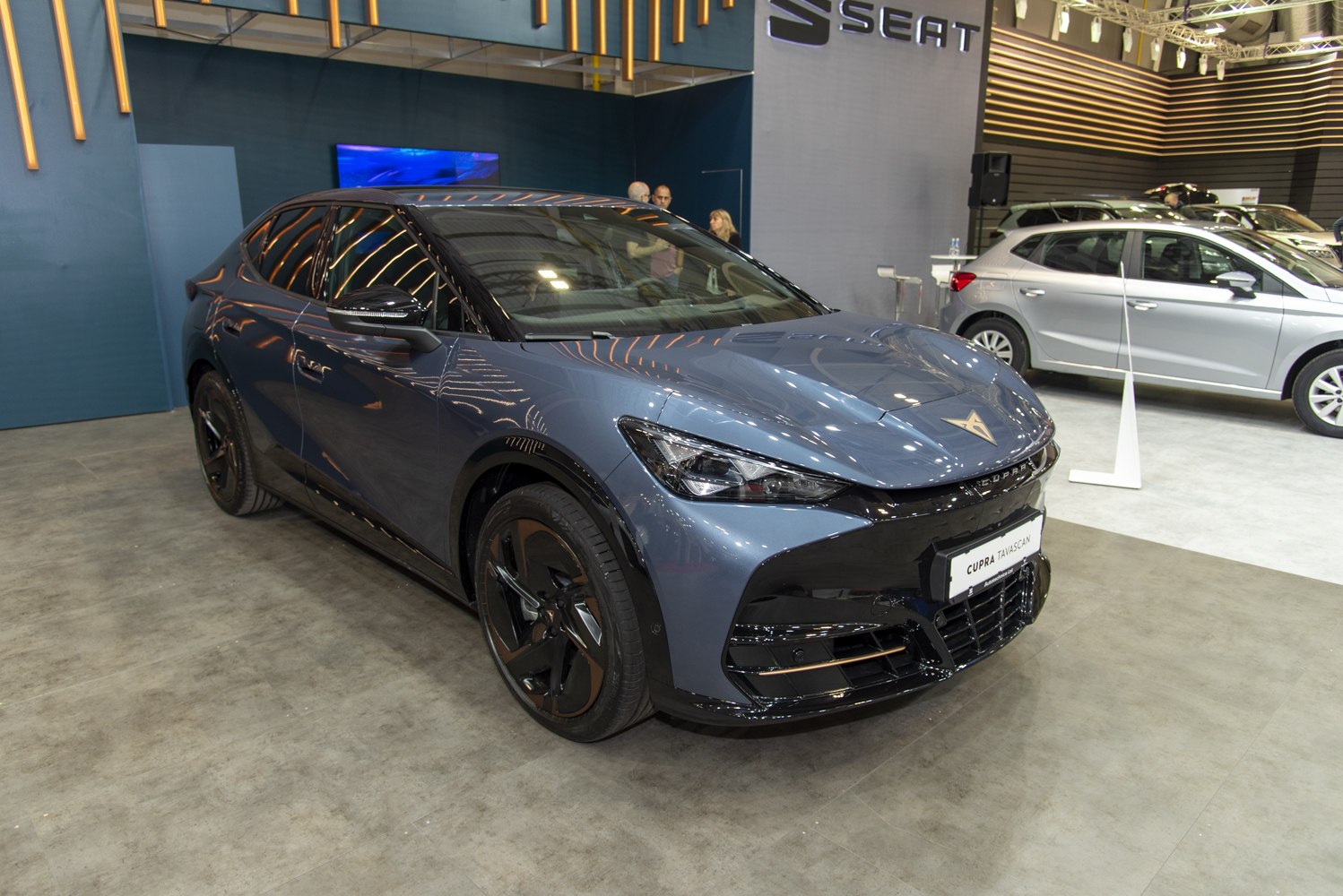 Sleek front and side view of an electric SUV with modern sharp headlights and aerodynamic design