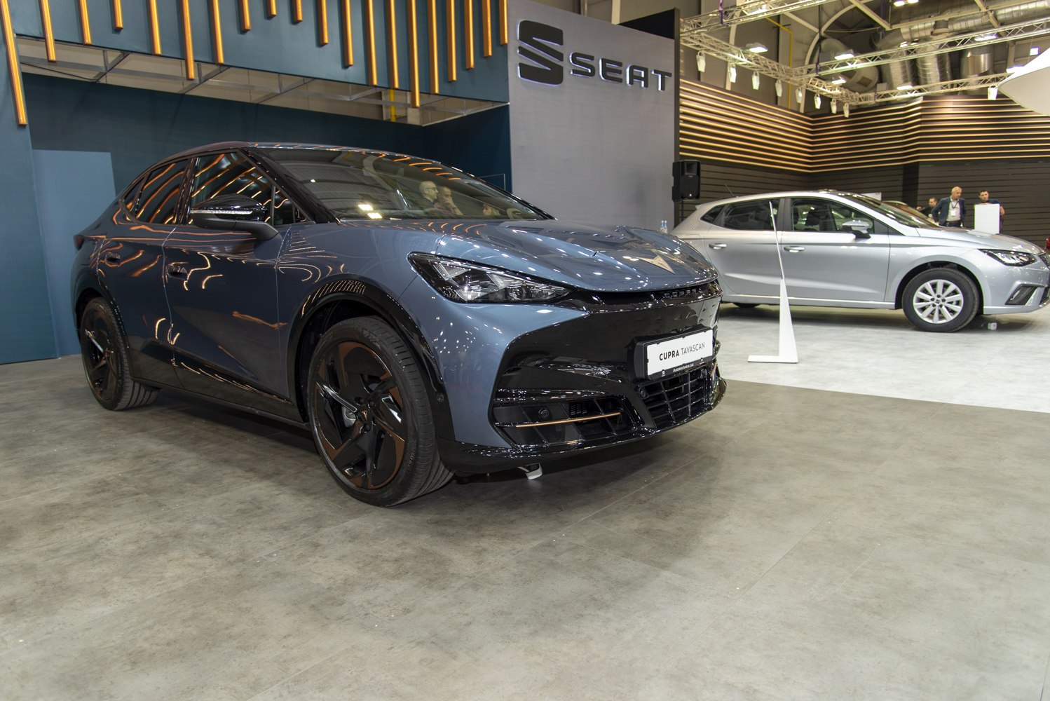 Sleek electric SUV with modern headlights and black alloy wheels.