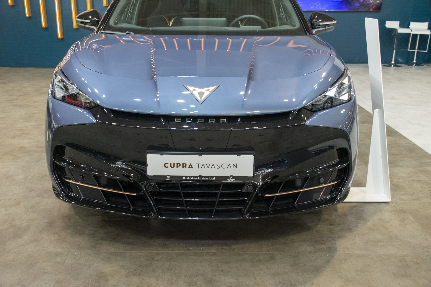 Sleek headlights and prominent grille with emblem