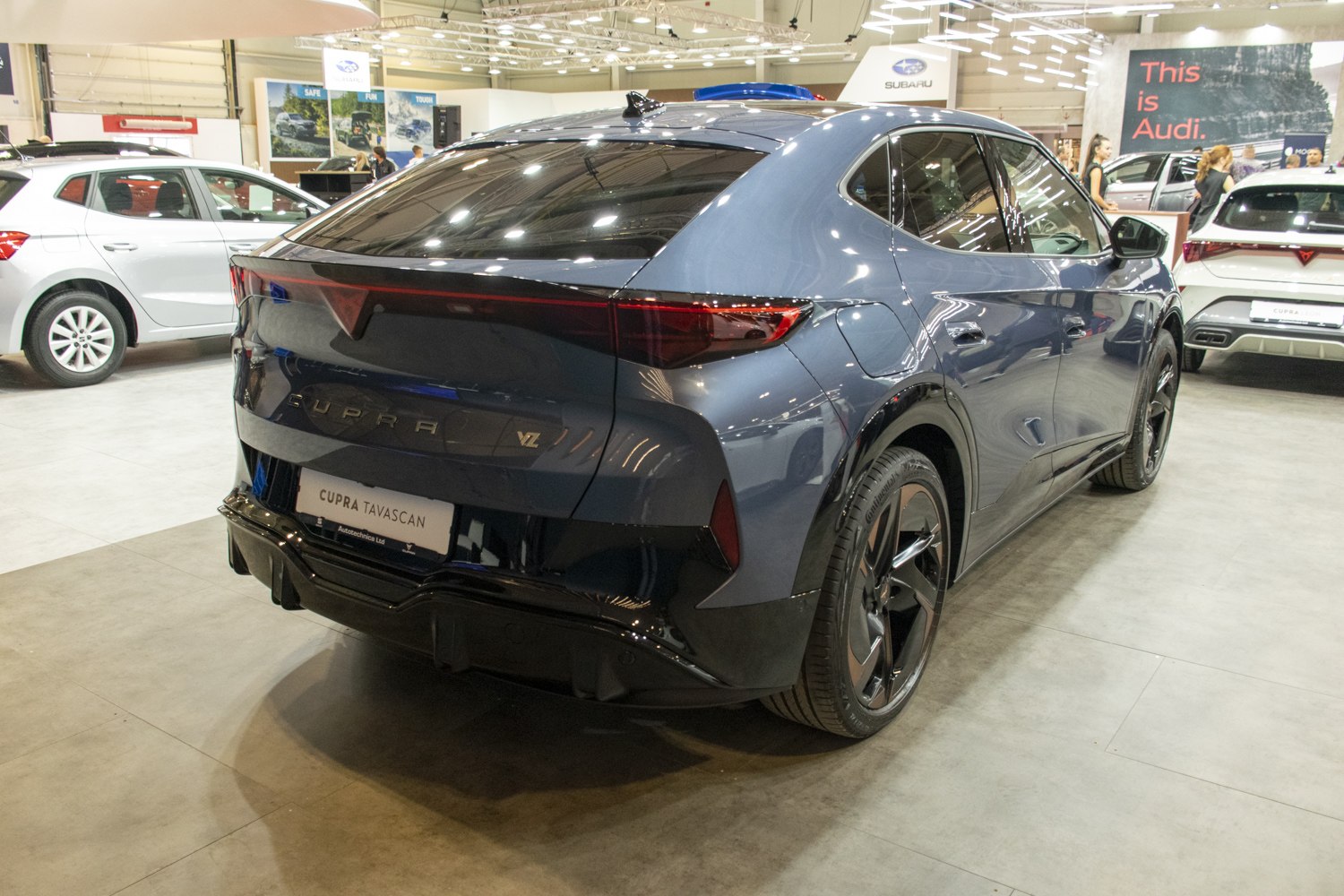 Rear view of sleek electric SUV with continuous LED taillights
