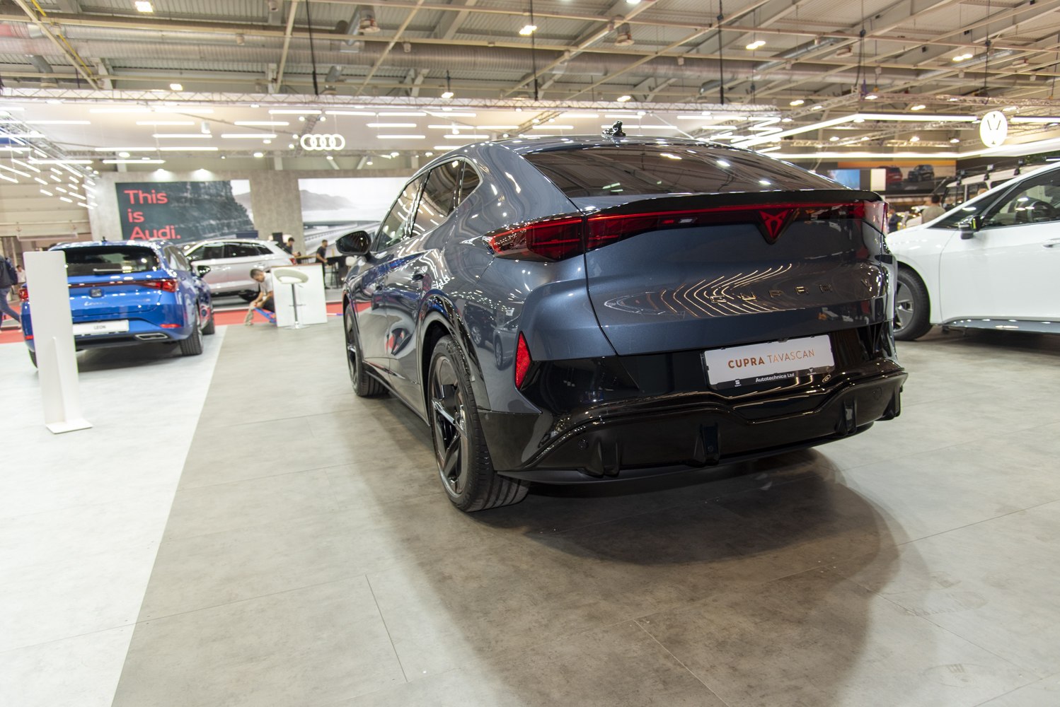 Electric SUV rear design with stylish integrated taillights and black alloy wheels.