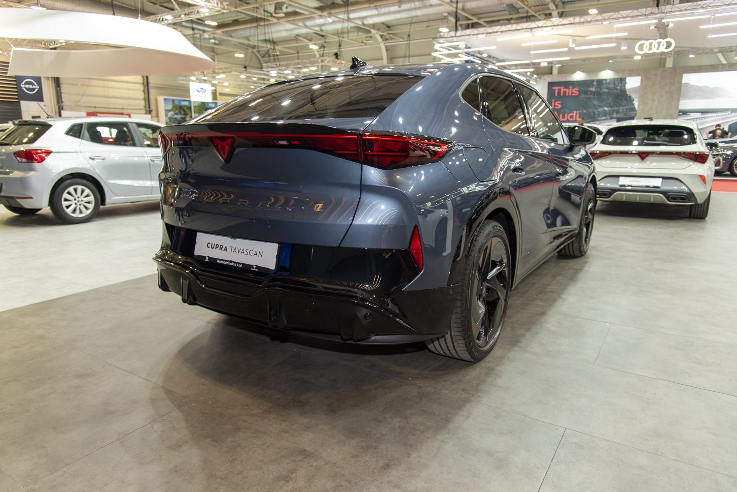 Rear view of sleek modern electric SUV with distinctive taillights.