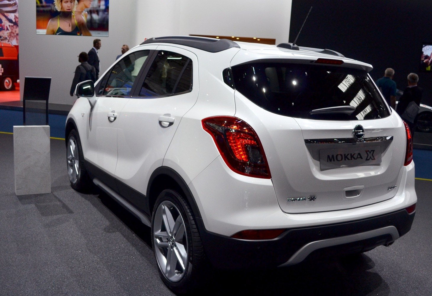Rear and side view of a white compact SUV with distinctive taillights and alloy wheels.