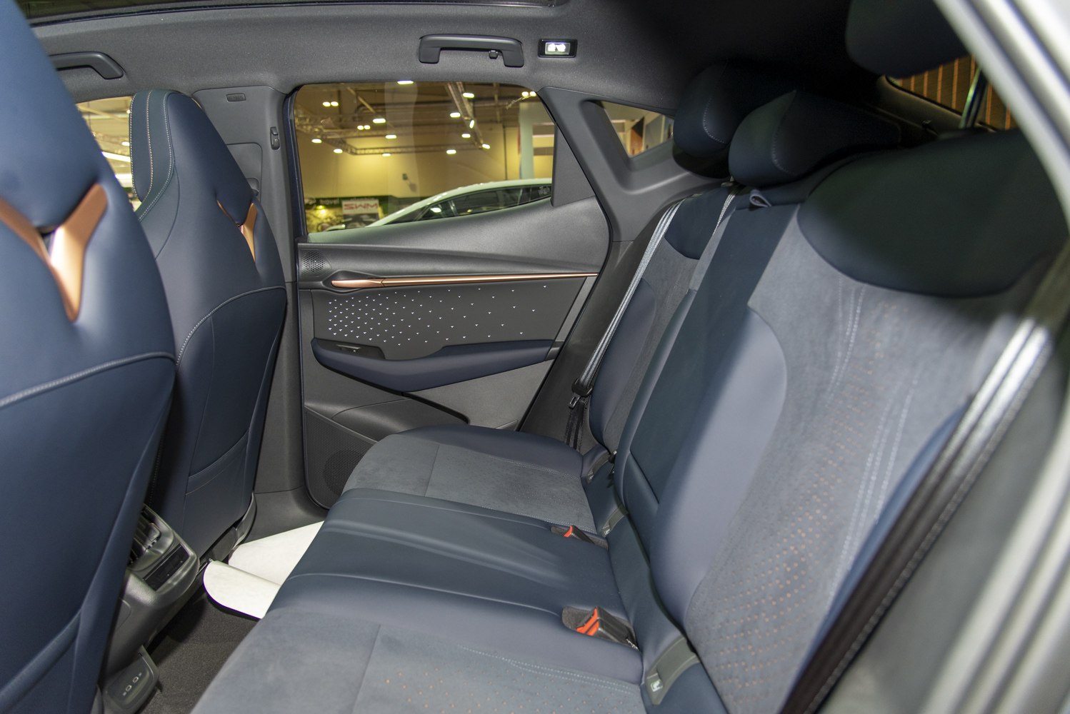 Rear seats with premium upholstery and modern door panel design
