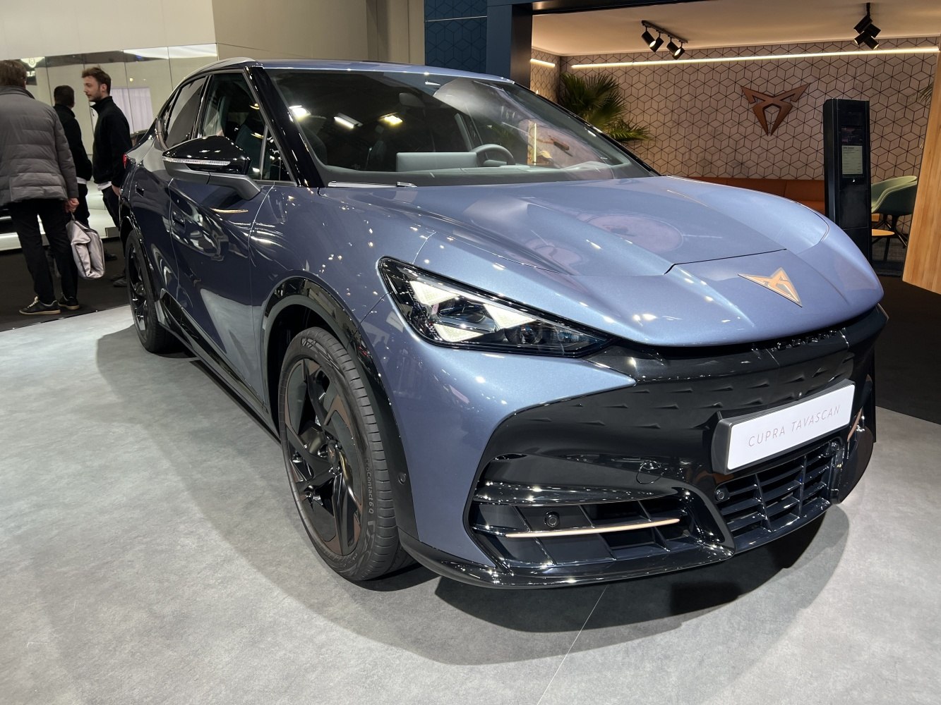 Front view of an electric SUV with sharp LED headlights and aerodynamic styling