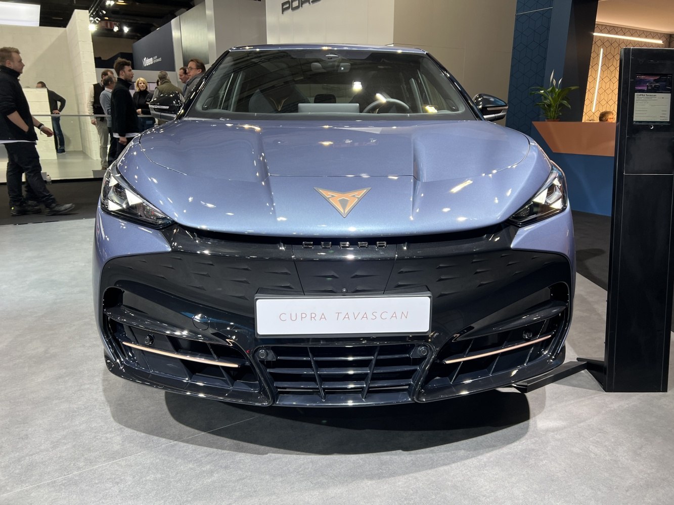 Front view with sharp headlights and aggressive grille design