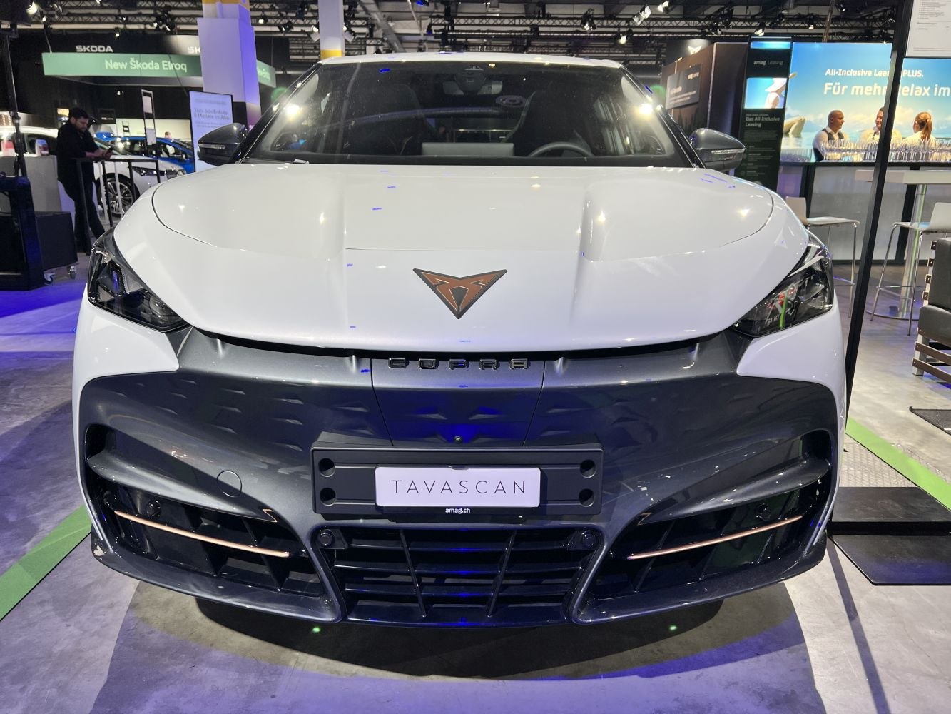Front view with sleek headlights and distinctive grille