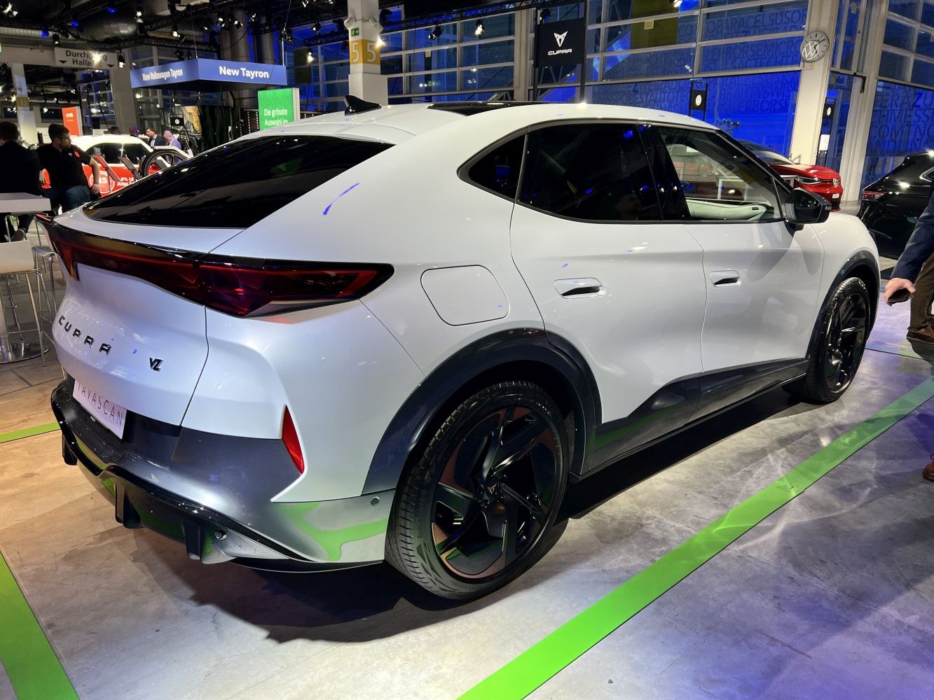 White electric SUV rear side view with sleek black wheels