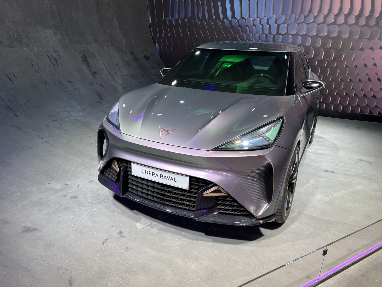 Futuristic front view with sharp headlights and aerodynamic grille