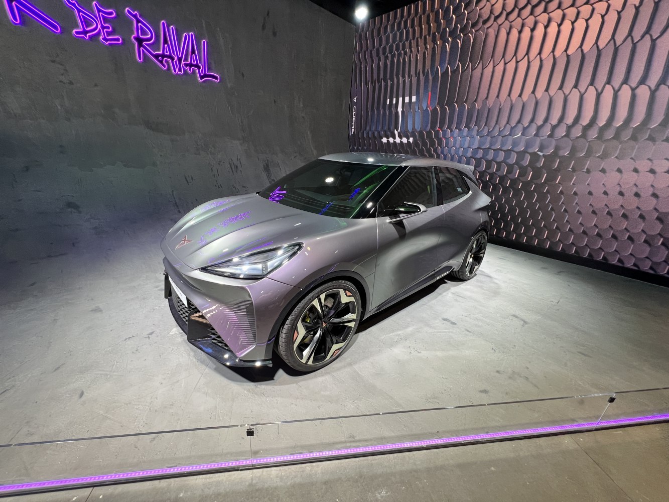 Sleek futuristic compact electric car with aerodynamic design and sharp lines.